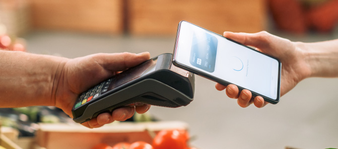 Person using payment app to pay via phone.