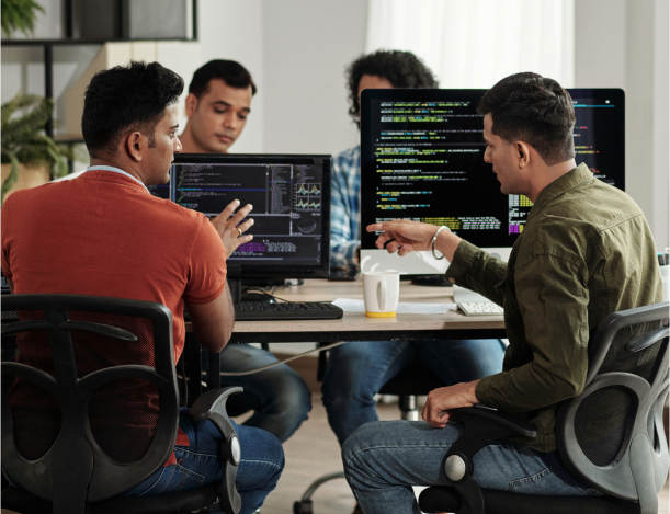 Development team reviewing code