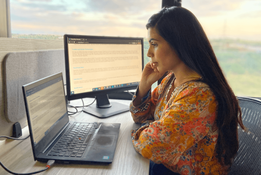 Woman working remotely on a laptop.