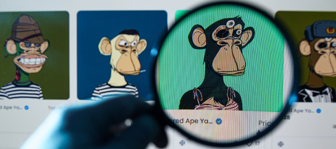 Magnifying glass over NFT artwork in marketplace, showing blockchain development for NFT trading.
